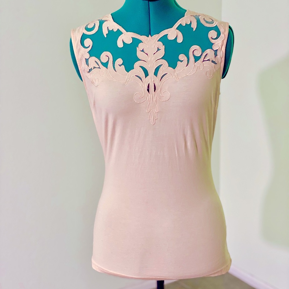Pink sleeveless top with neck detail